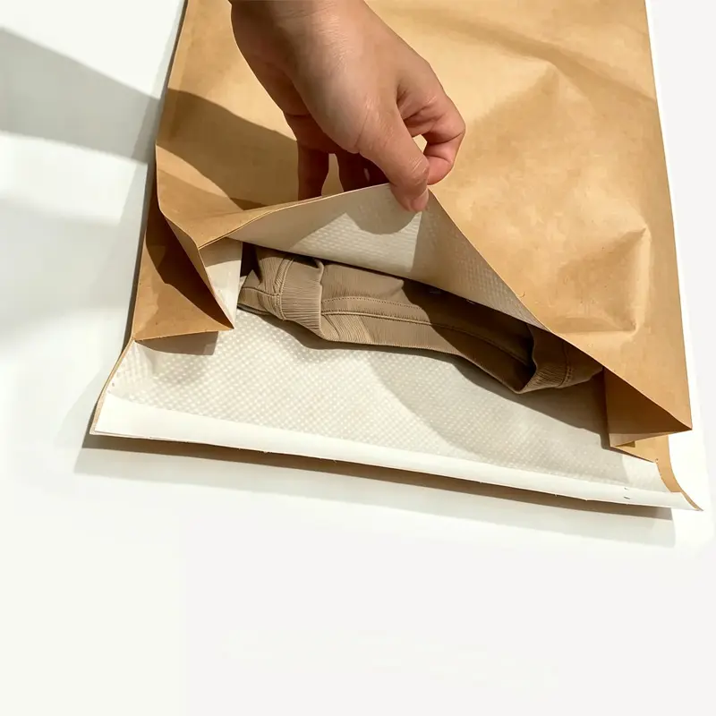 Heavy duty kraft mailer displaying a three-layer composite structure designed for shipping heavy garments